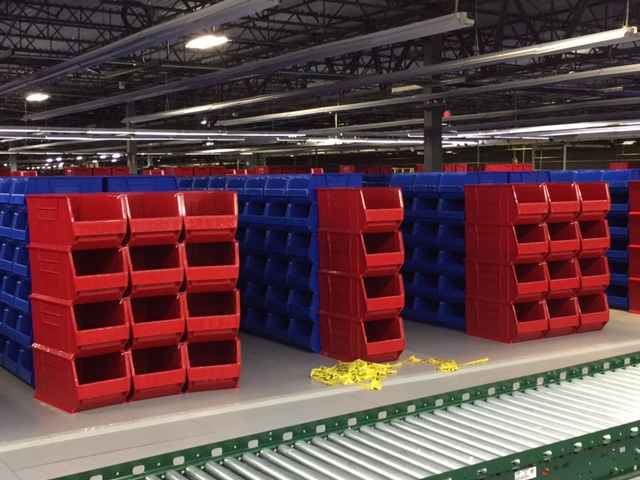 Stacked red and blue bins