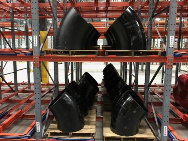 Large black industrial components stacked