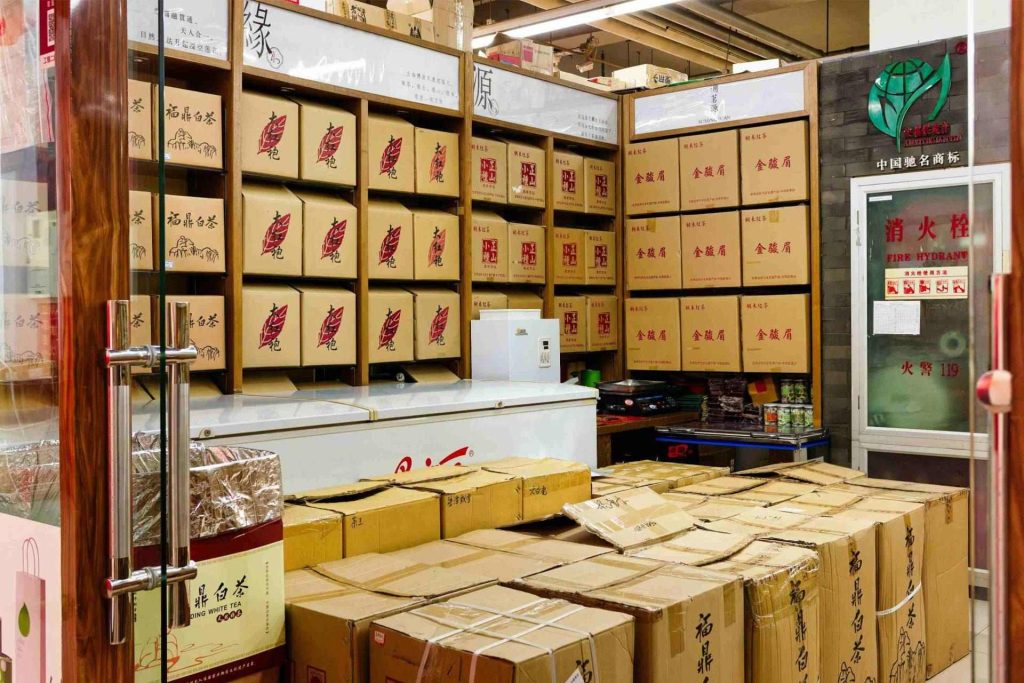 Boxes stacked in a small storage room